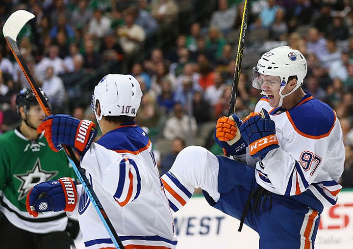 Connor McDavid #97 of the Edmonton Oilers celebrates his first career NHL goal against the Dallas Stars in the second period at American Airlines Center on October 13, 2015 in Dallas, Texas. 