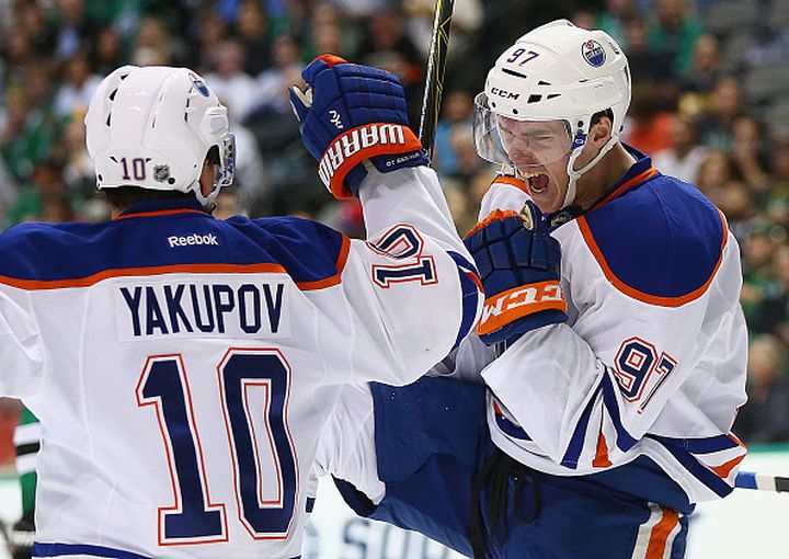 Connor McDavid #97 of the Edmonton Oilers celebrates his first career NHL goal against the Dallas Stars in the second period at American Airlines Center on October 13, 2015 in Dallas, Texas. 