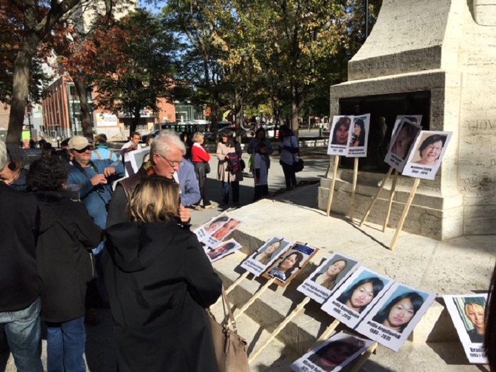 Photos of missing and murdered Aboriginal woman are on display at  the 10th Annual Memorial March and Vigil for Missing and Murdered Native Women in Cabot Square. Montreal, Sun. Oct. 4, 2015.