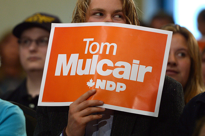 A NDP supporter holds a sign as Tom Mulcair arrives at a rally in Kamloops, B.C. on Tuesday Sept. 1, 2015. 