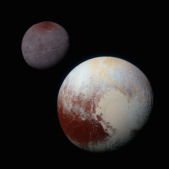 This composite of enhanced colour images of Pluto (lower right) and Charon (upper left), was taken by NASA’s New Horizons spacecraft as it passed through the Pluto system on July 14, 2015.