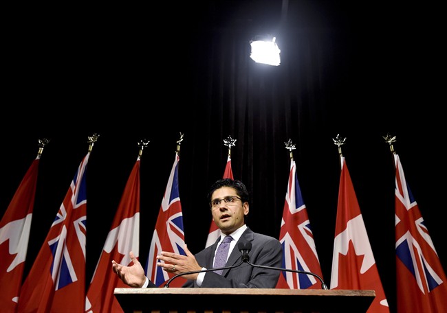 Attorney General Yasir Naqvi, explains a draft regulation for public input that would prohibit the random and arbitrary collection of identifying information by police, referred to as carding or street checks at Queen's Park in Toronto on Wednesday, October 28, 2015.