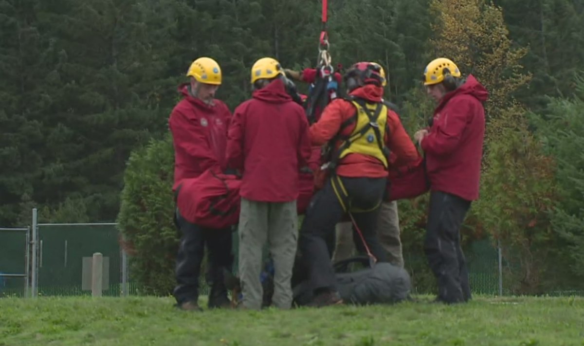 North Shore Rescue crews help bring an injured hiker to safety.