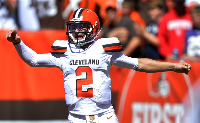 FILE - In this Sunday, Sept. 20, 2015 file photo, Cleveland Browns quarterback Johnny Manziel celebrates after a 60-yard touchdown pass to wide receiver Travis Benjamin in the first half of an NFL football game against the Tennessee Titans in Cleveland.