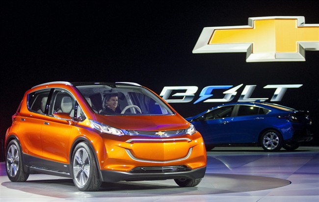 In this Jan. 12, 2015 file photo, the Chevrolet Bolt EV electric concept vehicle is unveiled during the North American International Auto Show, in Detroit. General Motors has promised to roll out the Bolt, a $40,000 fully electric car with a 200-mile range, in 2017.