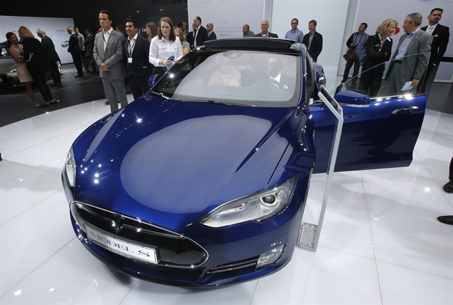 FILE - In this Sept. 15, 2015 file photo, a Tesla Model S is on display on the first press day of the Frankfurt Auto Show IAA in Frankfurt, Germany. Tesla Motors on Wednesday, Oct. 14, 2015 unveiled an autopilot system that lets its cars change lanes by themselves. It will be added to some Model S sedans and Model X SUVs through a software update. 