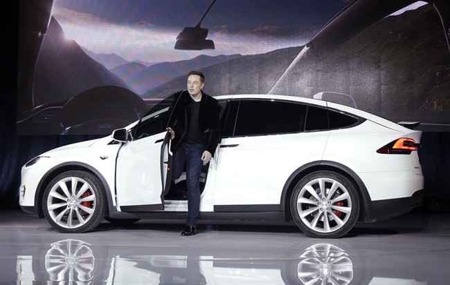 In this Sept. 29, 2015 file photo, Elon Musk, CEO of Tesla Motors Inc., introduces the Model X car at the company's headquarters in Fremont, Calif.