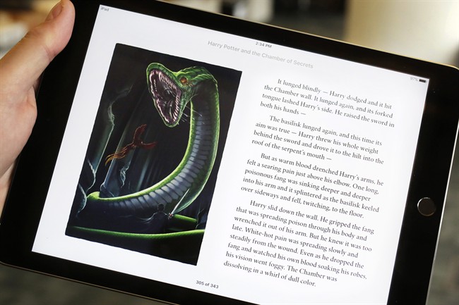 Text and an illustration from "Harry Potter and the Chamber of Secrets" are displayed on an iPad, Wednesday, Sept. 30, 2015, in New York. The J.K. Rowling books are being released with animated or interactive illustrations, but only through Apple’s iBooks Store and require the use of an Apple mobile device or a Mac computer. 