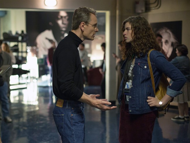 In this image released by Universal Pictures, Michael Fassbender, left, and Perla Haney-Jardine appear in a scene from, "Steve Jobs." (Francois Duhamel/Universal Pictures via AP).