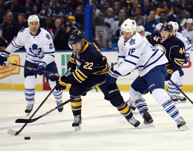 Buffalo Sabres left winger Johan Larsson (22), of Sweden, skates away from Toronto Maple Leafs center Nick Spaling (16) during the first period of an NHL hockey game, Wednesday, Oct. 21, 2015 in Buffalo, N.Y.