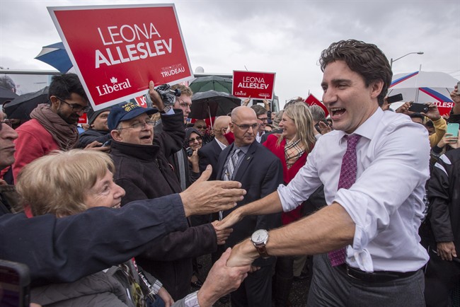 Liberal Leader Justin Trudeau makes his way through the crowd during a campaign stop Friday, Oct. 16, 2015 in Richmond Hill, Ont. 