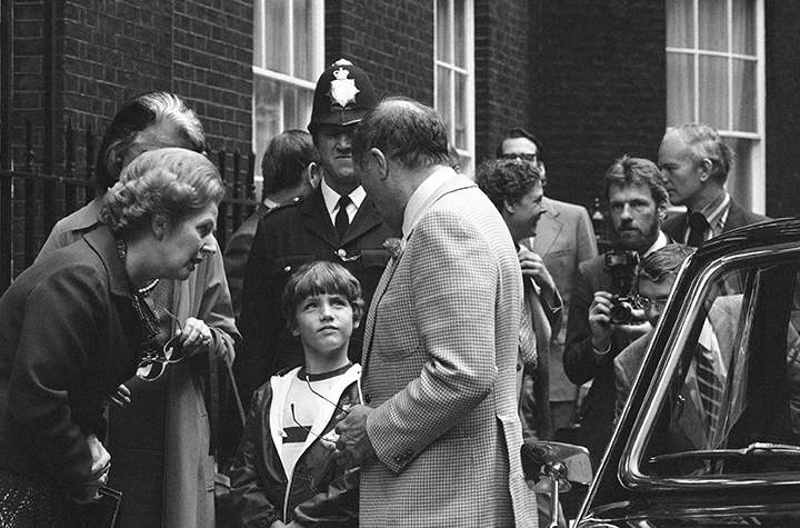 In this June 25, 1980, file photo, British Prime Minister Margaret Thatcher, left, Canadian Prime Minister Pierre Trudeau, center, facing left, and his son Justin, 8, speak outside No. 10 Downing Street, in London.