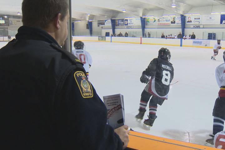 Winnipeg Police officer at a minor hockey game.
