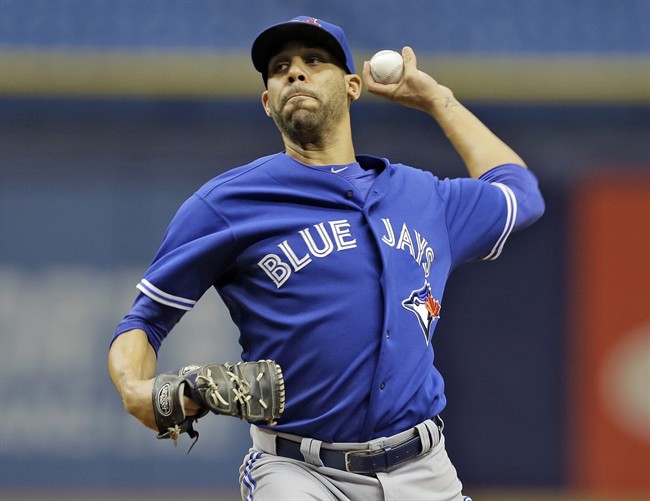 Toronto Blue Jays starting pitcher David Price delivers to Troy Tulowitzki during a simulated game before a baseball game between the Tampa Bay Rays and the Blue Jays Friday, Oct. 2, 2015, in St. Petersburg, Fla.