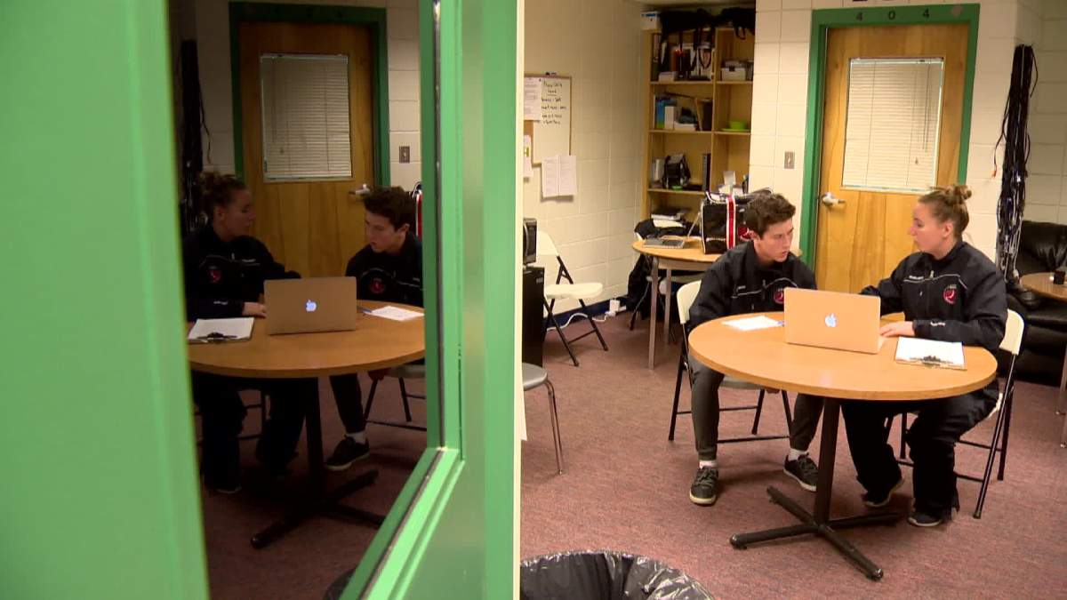 Ben Sanderson going over his skating with a Global Sport coach.