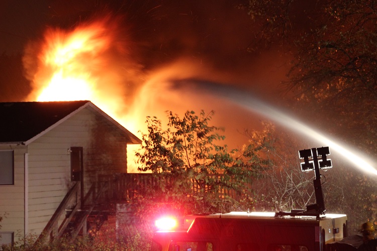 Man in custody after suspicious fire guts Surrey home - BC | Globalnews.ca