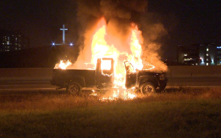 A pickup truck catches on fire on Hwy 400 on Oct. 21, 2015.