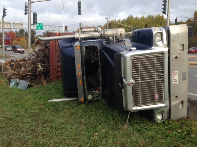 Truck rolls on its side on the ramp to the Princess Margaret Bridge in Fredericton. 