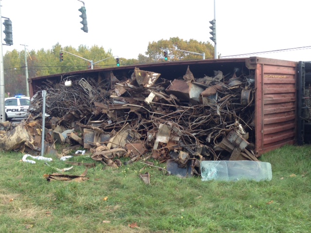 Truck rolls on its side on the ramp to the Princess Margaret Bridge in Fredericton.