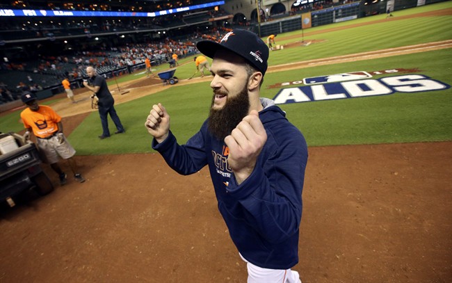 Houston Astros' Dallas Keuchel smiles as he gestures to the stands after winning Game 3 of baseball's American League Division Series against the Kansas City Royals Sunday, Oct. 11, 2015, in Houston. The Astros won 4-2.