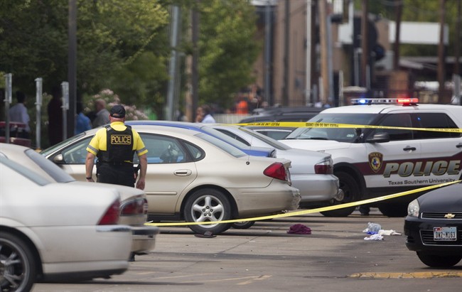 Authorities investigate a shooting at Texas Southern University, Friday, Oct. 9, 2015, in Houston. A student was killed and another person was wounded in a shooting outside a student-housing complex on Friday, and police have detained at least two people, authorities said. 