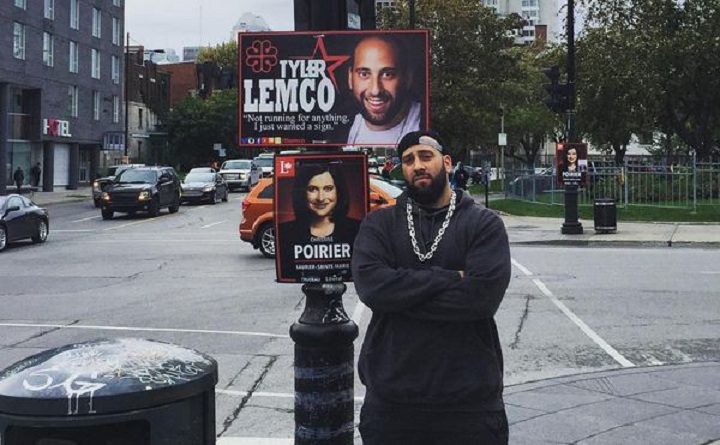 Tyler Lemco stands next to a poster of himself on Saint-Laurent and Sherbrooke, Tuesday, October 6, 2015.