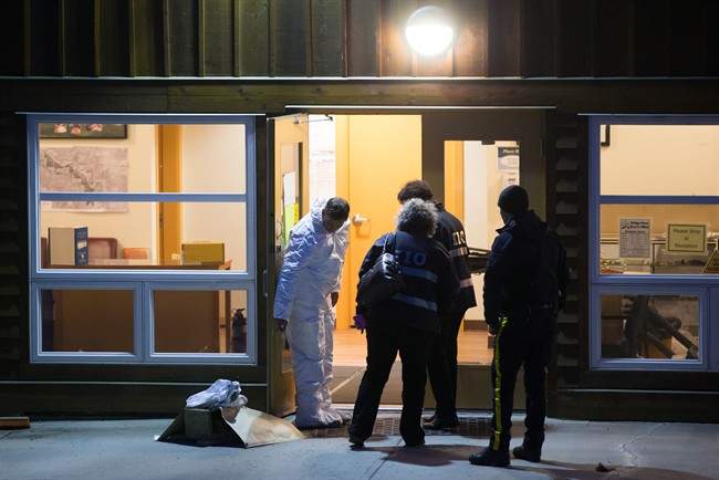 Investigators enter the Bridge River Indian Band office where one man died and nine others were injured following an attack, near Lillooet, B.C., on Wednesday October 14, 2015. A man suspected in a violent assault is dead and 10 others are hurt after an attack that reportedly involved a hammer. 