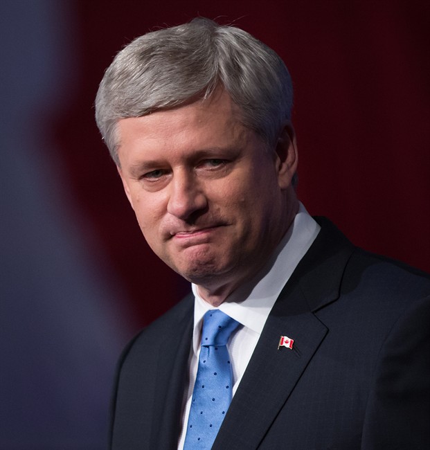 Conservative Leader Stephen Harper pauses while addressing supporters at an election night gathering in Calgary, Alta., on Monday October 19, 2015. 