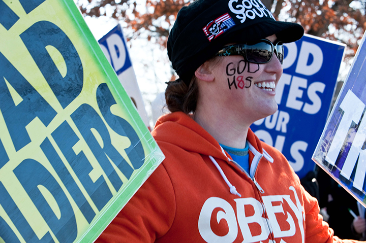 Megan Phelps-Roper of the Westboro Baptist Church, a Kansas church known for its vehement anti-gay positions and for protesting at US soldiers' funeral, stage a protest across the street from Northwestern High School in Hyattsville, Maryland, outside Washington, on March 1, 2011. 