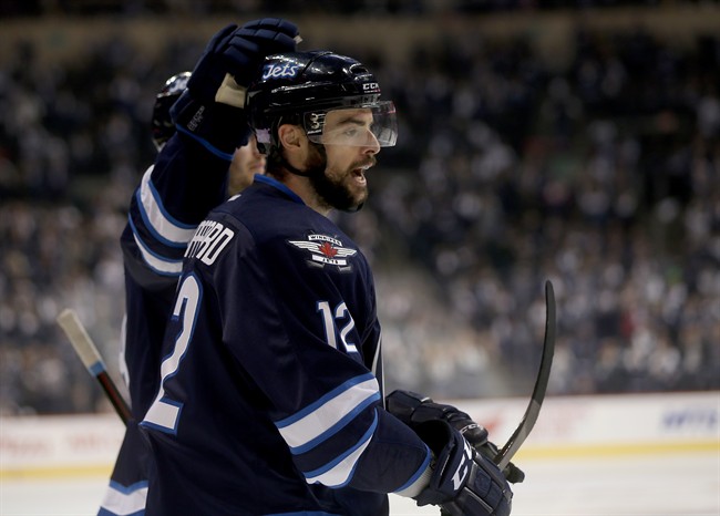 Winnipeg Jets' Drew Stafford celebrates a goal with Jacob Trouba during a game on Oct. 25, 2015.