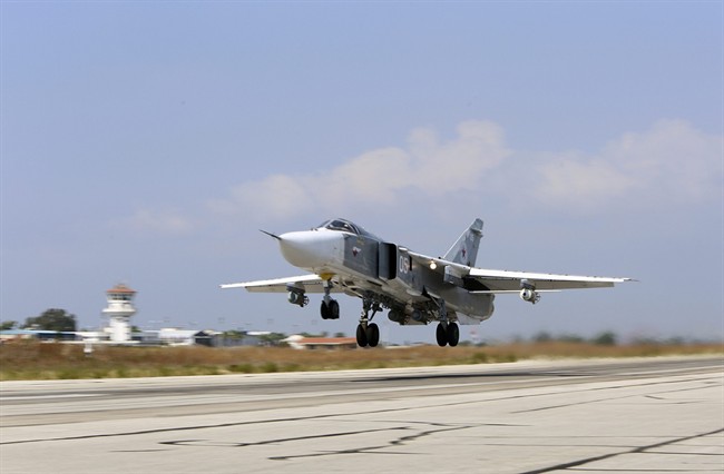  In this  file photo, a Russian SU-24M jet fighter armed with laser guided bombs takes off from a runaway at Hmeimim airbase in Syria.