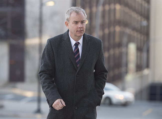 Dennis Oland heads to the Law Courts as his murder trial continues in Saint John, N.B., on Wednesday, October 21, 2015.
