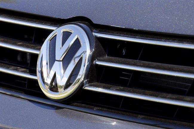 FILE - In this Sept. 24, 2015, file photo, the grille of a Volkswagen car for sale is decorated with the iconic company symbol in Boulder, Colo.