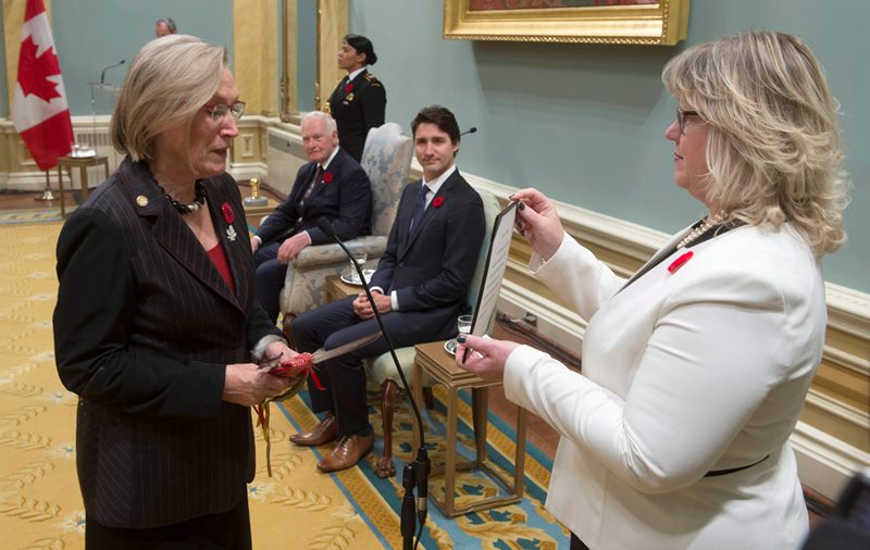 Governor General David Johnston and Prime Minister Justin Trudeau look on as Carolyn Bennett is sworn in as the Minister of Indigenous and Northern Affairs during ceremonies at Rideau Hall, Wednesday Nov.4, 2015 in Ottawa.