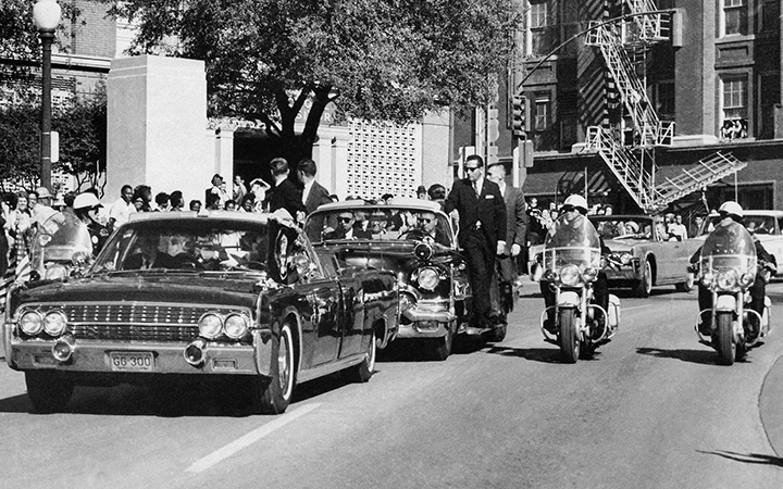President John F. Kennedy's limo with the license plates reading GG 300 seconds after being fatally shot on Elm Street in Dallas, Texas on Nov. 22, 1963.