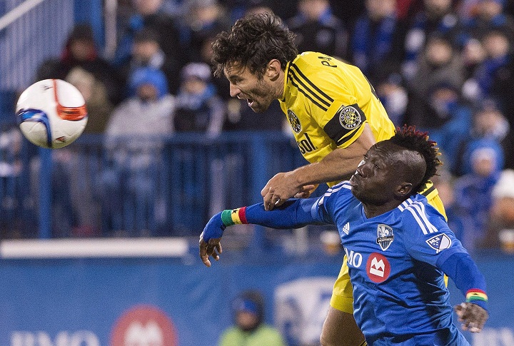 Montreal Impact's Dominic Oduro, right, challenges Columbus Crew SC's Michael Parkhurst during second half first leg MLS playoff soccer action in Montreal on November 1, 2015. The Montreal Impact are a confident group these days and they'll need that heading into the second leg of their Major League Soccer semifinal in Columbus.The Impact go into the decisive match at MAPFRE Stadium on Sunday holding a one-goal lead in the two games, total goals series thanks to a 2-1 victory at home last week. Saturday, Nov. 7, 2015.
