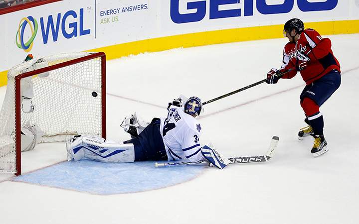 Washington Capitals left wing Alex Ovechkin scores the winning goal past Toronto Maple Leafs goalie James Reimer in a shootout on Saturday, Nov. 7, 2015, in Washington. The Capitals won 3-2 in overtime.
