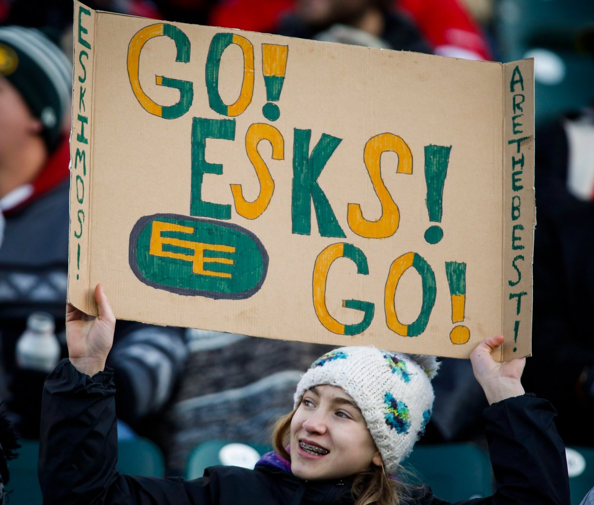 An Edmonton Eskimos' fan cheers during first half CFL West Division final football action against the Calgary Stampeders in Edmonton, Sunday, Nov. 22, 2015.