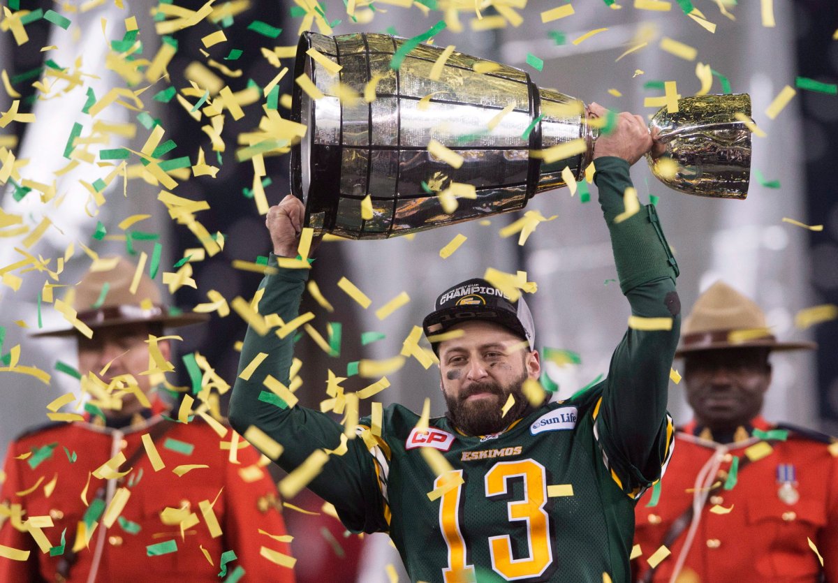 Edmonton Eskimos' quarterback Mike Reilly hoists the Grey Cup after his teams win over the Ottawa Redblacks during the 103rd Grey Cup in Winnipeg, Man. Sunday, Nov. 29, 2015.