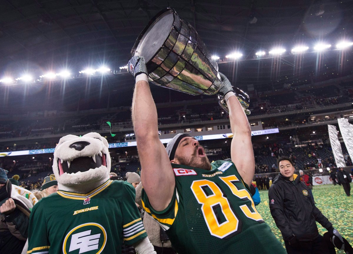 Edmonton Eskimos' Nate Coehoorn hoists the Grey Cup after his teams win over the Ottawa Redblacks during the103rd Grey Cup in Winnipeg, Man.