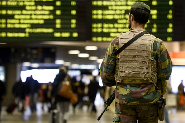 A military police soldier patrols the Brussels Midi train station on November 18, 2015 in Brussels. Belgium's national security level has been raised to three, following a series of coordinated attacks by Islamic State jihadists in Paris on November 13 that killed at least 129 people, including 3 Belgians, in scenes of carnage at a concert hall, restaurants and the national stadium, and connections following the attack between the terrorists and to Molenbeek, in west Brussels.       