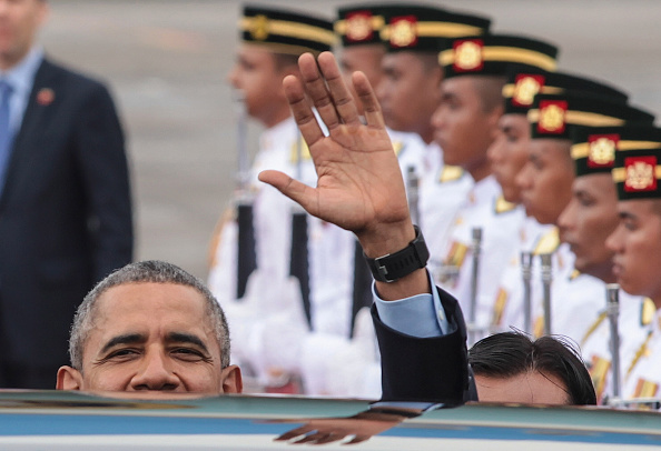 U.S. President Barack Obama wave to media after arrive at the Royal Malaysian Air Force base ahead of the 27th Association of South-East Asian Nations (ASEAN) Summit on November 20, 2015 in Subang, Malaysia. Obama is traveling on a 9-day trip to Turkey, the Philippines and Malaysia for international summits.  (Photo by Mohd Samsul Mohd Said/Getty Images).