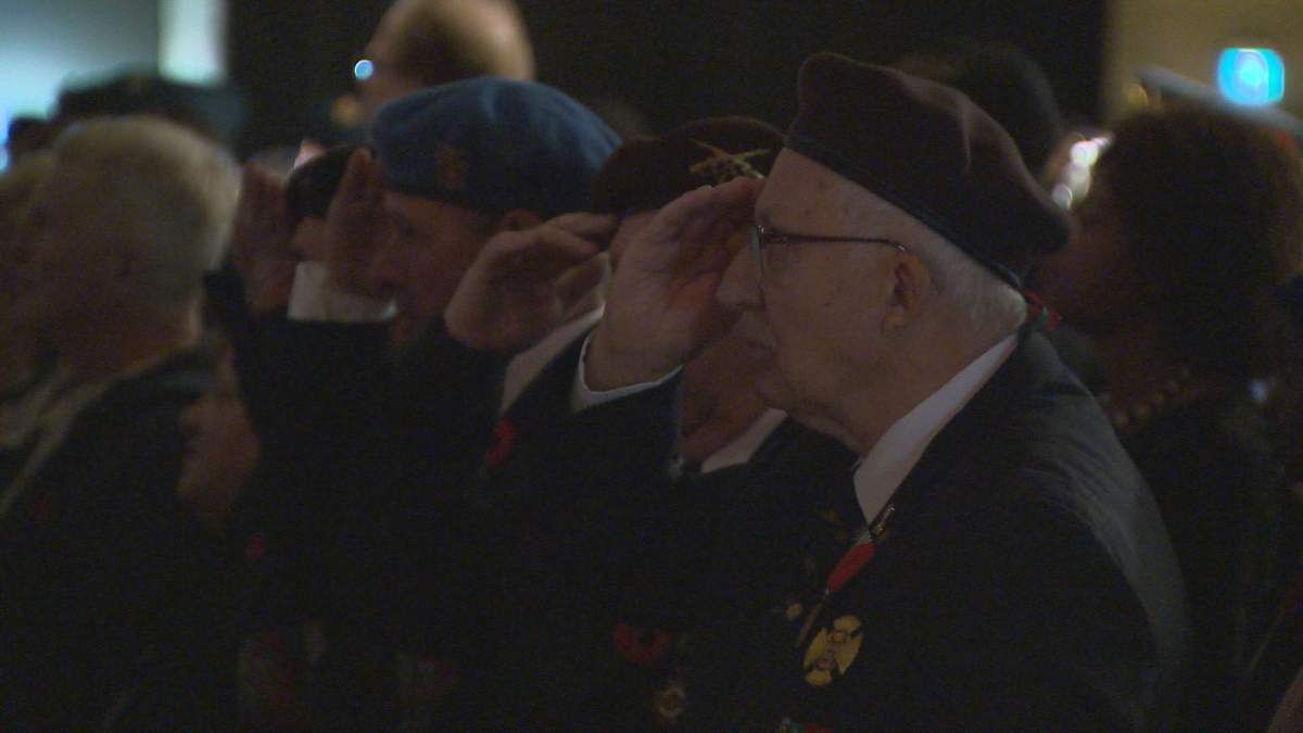 Veterans saluting during a Remembrance Day ceremony at the Convention Centre.