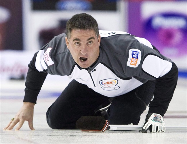 Skip Wayne Middaugh yells after throwing his rock while playing against Team Howard during the 2009 Canadian Olympic Curling Trials in Edmonton on Monday, Dec. 7, 2009. The 2012 world champion has returned to the Brier with his old teammate, Glenn Howard.