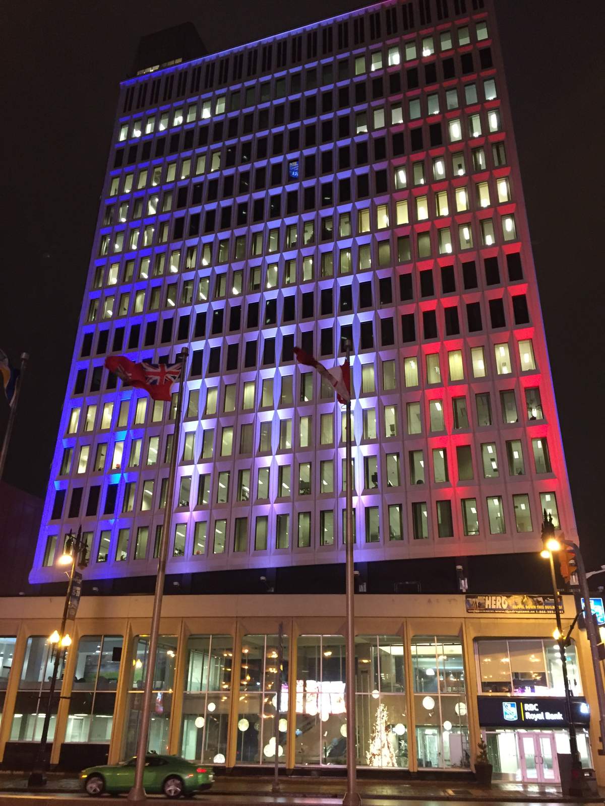 Winnipeg’s RBC Convention Centre lit up in the French flag colours.