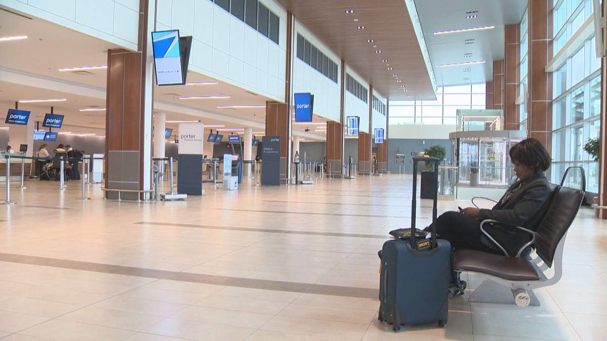 Affiba Heishman, an American, stayed at Halifax Stanfield International Airport Wednesday morning while she tried to find an earlier flight. She said she was afraid she will miss her mother's funeral on Friday because her plane was diverted.