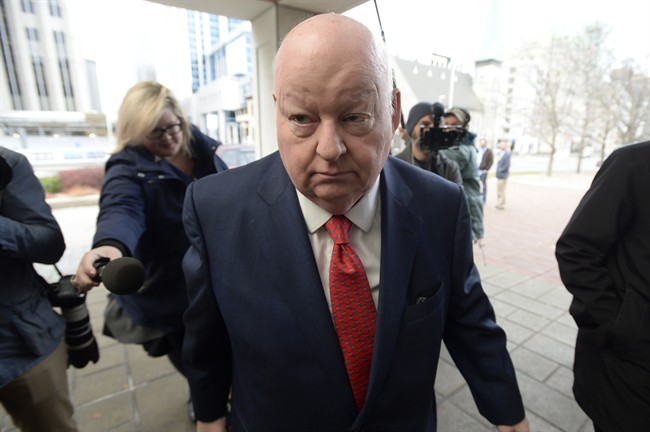Sen. Mike Duffy, a former member of the Conservative caucus, makes his way to the courthouse as his trial resumes, Thursday Nov. 19, 2015 in Ottawa. THE CANADIAN PRESS/Adrian Wyld.