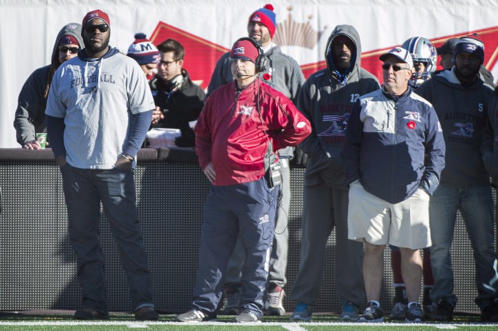 Montreal Alouettes' head coach Jim Popp, centre, looks on from the sidelines during first half CFL football action against the Saskatchewan Roughriders, in Montreal, on Sunday, November 8, 2015.