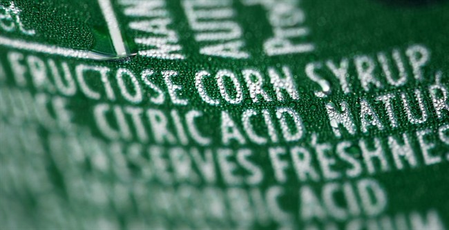 This Sept. 15, 2011 file photo shows a nutrition label that lists high fructose corn syrup as an ingredient in a can of soda.