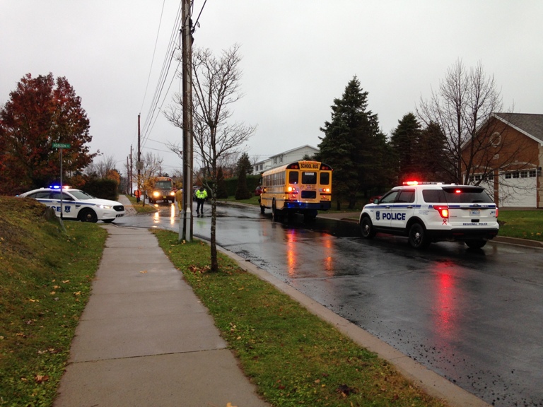 Police on scene an accident involving a vehicle and school bus in Bedford.
